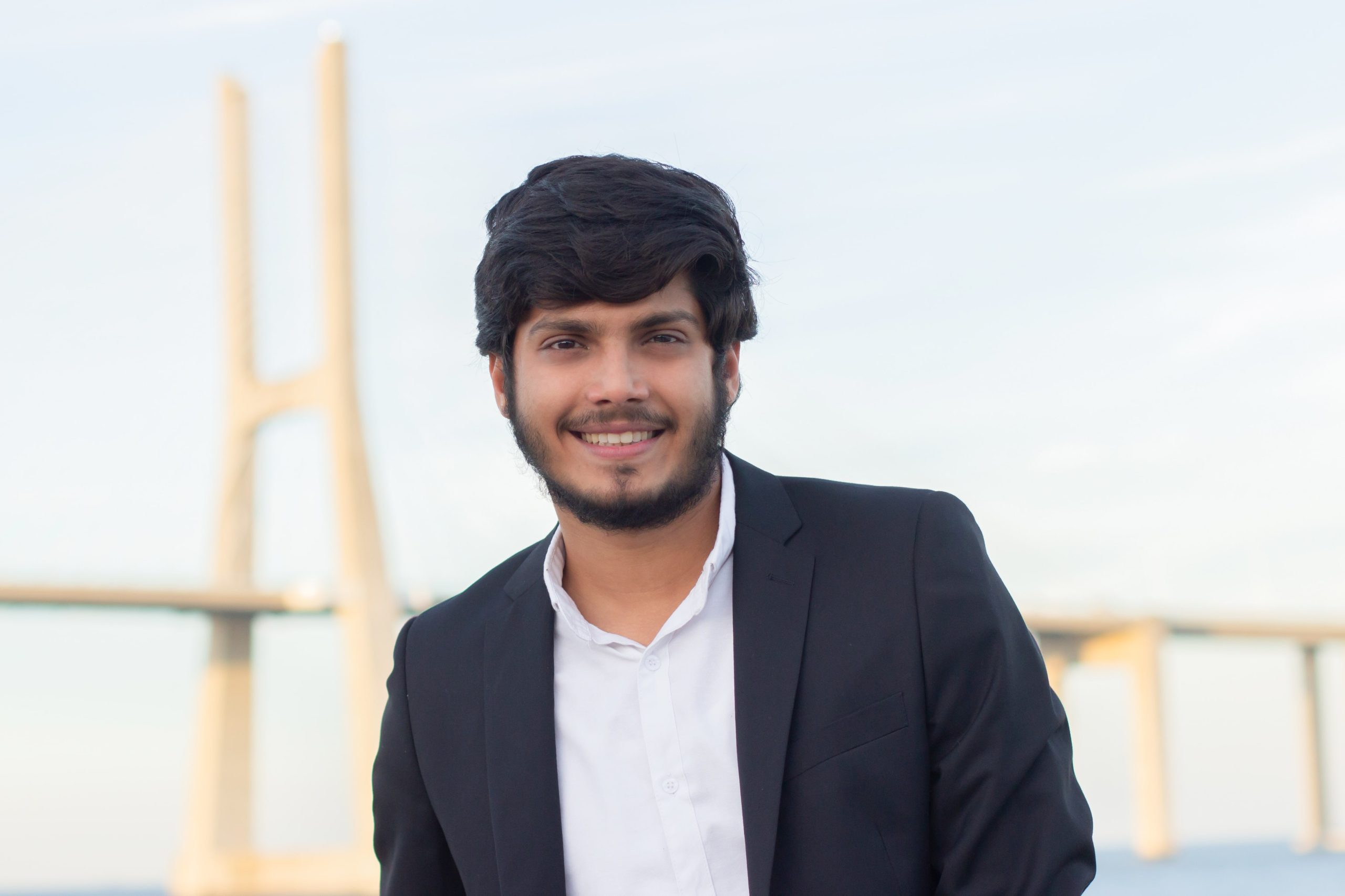 portrait-good-looking-smiling-arabic-man-suit-attractive-young-businessman-with-beard-moustache-looking-camera-portrait-international-beauty-concept-min